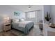 Bright bedroom boasts a large window with a view and a coastal-themed rug at 6287 Bahia Del Mar Cir # 801, St Petersburg, FL 33715