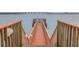 Long wooden dock with stairs leads out into the serene water, offering stunning views at 6287 Bahia Del Mar Cir # 801, St Petersburg, FL 33715