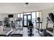 Well-equipped gym with treadmills, weights, and views of the water at 6287 Bahia Del Mar Cir # 801, St Petersburg, FL 33715