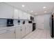 Well-lit kitchen with white cabinetry, sleek countertops, and modern appliances at 6287 Bahia Del Mar Cir # 801, St Petersburg, FL 33715
