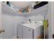 Functional laundry room equipped with modern washer and dryer units and ample shelving at 6287 Bahia Del Mar Cir # 801, St Petersburg, FL 33715