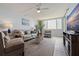 Comfortable living room with modern furnishings, area rug, and scenic water view at 6287 Bahia Del Mar Cir # 801, St Petersburg, FL 33715