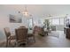 Open-concept living and dining area with large windows offering natural light and views at 6287 Bahia Del Mar Cir # 801, St Petersburg, FL 33715