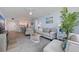 Open-concept living room with neutral tones, comfortable seating, and easy access to the kitchen at 6287 Bahia Del Mar Cir # 801, St Petersburg, FL 33715