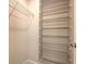 Walk-in closet with multiple metal racks for ample storage space at 6633 Applewood Dr, Wesley Chapel, FL 33544