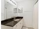 Bathroom features a vanity with granite countertop, a sink, and a large framed mirror at 700 S Harbour Island Blvd # 342, Tampa, FL 33602