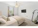 Bright bedroom featuring neutral walls, carpet floors, a ceiling fan, and a large window for natural light at 700 S Harbour Island Blvd # 342, Tampa, FL 33602