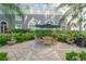 A beautiful courtyard with a wood table and chairs, flowers, landscaping, and a great umbrella at 700 S Harbour Island Blvd # 342, Tampa, FL 33602