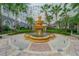 Beautiful courtyard with a large tiered fountain surrounded by tropical landscaping and a multistory building at 700 S Harbour Island Blvd # 342, Tampa, FL 33602