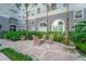 A patio in a courtyard has a table, chairs, flowers, plants, landscaping and access to nature at 700 S Harbour Island Blvd # 342, Tampa, FL 33602