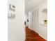 Hallway with hardwood flooring, white walls, and white closet doors offers a seamless flow to the rest of the home at 700 S Harbour Island Blvd # 342, Tampa, FL 33602