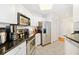 Well-equipped kitchen with stainless steel appliances, black countertops, white cabinets, and ample storage space at 700 S Harbour Island Blvd # 342, Tampa, FL 33602