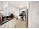 Efficient kitchen with white cabinets, stainless steel appliances, granite countertops, and tile floors for easy maintenance at 700 S Harbour Island Blvd # 342, Tampa, FL 33602