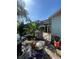 Enclosed outdoor pool area surrounded by lush vegetation, backyard and patio at 7421 Mulligan Ct, Port Richey, FL 34668