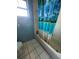 Bathroom with a shower/tub combo and essential fixtures at 7421 Mulligan Ct, Port Richey, FL 34668
