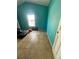 Turquoise bedroom with a window and tile floors at 7421 Mulligan Ct, Port Richey, FL 34668