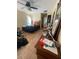 Bedroom featuring tile floors with a blue bed at 7421 Mulligan Ct, Port Richey, FL 34668