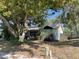 Charming single-story home with a well-manicured front yard and mature trees at 7421 Mulligan Ct, Port Richey, FL 34668