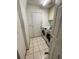 Laundry room with essential appliances and ample space at 7421 Mulligan Ct, Port Richey, FL 34668