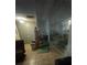 Spacious living area with tiled floors and a mirrored wall at 7421 Mulligan Ct, Port Richey, FL 34668