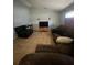 Comfortable living room with tile floors, ideal for relaxation and entertaining at 7421 Mulligan Ct, Port Richey, FL 34668