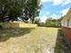 Spacious backyard with a new wooden fence providing privacy and security at 8310 Croton Ave, Tampa, FL 33619