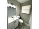 Well-lit bathroom with a modern vanity, updated fixtures, and a window at 8310 Croton Ave, Tampa, FL 33619