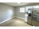 Eat in kitchen features white cabinets, stainless steel appliances, and tile flooring at 8310 Croton Ave, Tampa, FL 33619