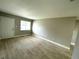 Bright living room showcasing tile flooring, a window, and neutral wall paint at 8310 Croton Ave, Tampa, FL 33619