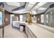 Bright bathroom features a large vanity with dual sinks, ample lighting and storage at 833 Lakeside Ter, Palm Harbor, FL 34683