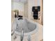 Large, light-colored bathroom with large soaking tub and spa-like features at 833 Lakeside Ter, Palm Harbor, FL 34683