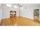 Bright bedroom with hardwood floors, built-in shelving, and private bathroom at 833 Lakeside Ter, Palm Harbor, FL 34683
