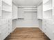 Walk-in closet with multiple sections and levels of shelving and drawers at 833 Lakeside Ter, Palm Harbor, FL 34683