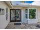 Elegant glass double doors with craftsman style windows providing natural light to entry at 833 Lakeside Ter, Palm Harbor, FL 34683