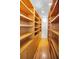 Walk-in closet with custom wood shelving, hardwood floors, and built-in storage at 833 Lakeside Ter, Palm Harbor, FL 34683