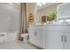 Bathroom with white cabinets, a bath, and modern fixtures at 845 Steel Dr, Apollo Beach, FL 33572
