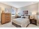 Neutral bedroom with a dresser, a bed, and a night stand at 845 Steel Dr, Apollo Beach, FL 33572