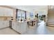 Open-concept living space combining the kitchen, dining, and living areas, with stairs to the next level at 845 Steel Dr, Apollo Beach, FL 33572
