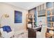 Cozy home office with desk, chair, and natural light streaming through the window at 845 Steel Dr, Apollo Beach, FL 33572