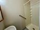 Cozy bathroom featuring toilet and walk-in shower at 9230 Wood Dr, Hudson, FL 34667