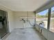 Enclosed porch with concrete floor at 9230 Wood Dr, Hudson, FL 34667