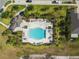 Avelar Creek boasts a luxurious pool area, equipped with inviting lounge chairs, tables, and beautiful landscaping at 10013 Caraway Spice Ave, Riverview, FL 33578