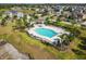 Avelar Creek features a bright blue community pool surrounded by green landscaping and homes nearby at 10013 Caraway Spice Ave, Riverview, FL 33578