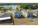 Aerial view showcasing homes with backyards, lake views, and community amenities at 10013 Caraway Spice Ave, Riverview, FL 33578