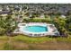 Avelar Creek features a blue community pool with plenty of seating and a covered patio area, near homes at 10013 Caraway Spice Ave, Riverview, FL 33578