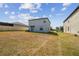 The property has an expansive backyard with lush grass and a partial view of the home's exterior at 10013 Caraway Spice Ave, Riverview, FL 33578