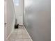 Inviting entryway featuring neutral tones, tile flooring, and a bright front door at 10013 Caraway Spice Ave, Riverview, FL 33578