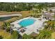 Avelar Creek's stunning pool and clubhouse are surrounded by lush landscaping, creating an ideal gathering spot at 10013 Caraway Spice Ave, Riverview, FL 33578