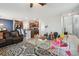 Open living space with tile flooring, connecting the living room to the kitchen and front entry at 10013 Caraway Spice Ave, Riverview, FL 33578
