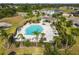 Avelar Creek features a bright blue community pool with plenty of seating and a covered patio area at 10013 Caraway Spice Ave, Riverview, FL 33578